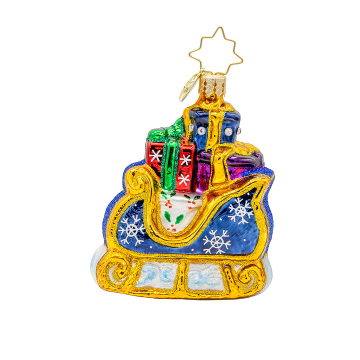 Starry Night Sleigh Gem ornament. A blue sleigh with gold trim, piled high with gifts. View of back.