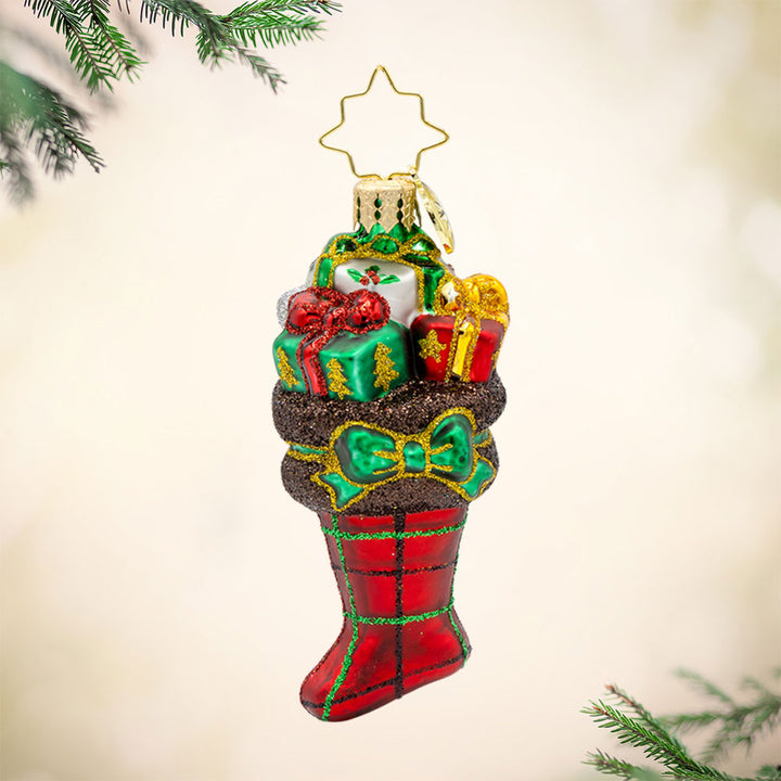 Festive Tartan Treasures Gem ornament. A red tartan stocking filled with gifts. View of front. 