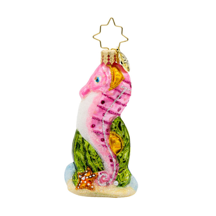 Sally Seahorse Gem ornament. A pink seahorse hides within emerald seaweed and seafoam. View of back.