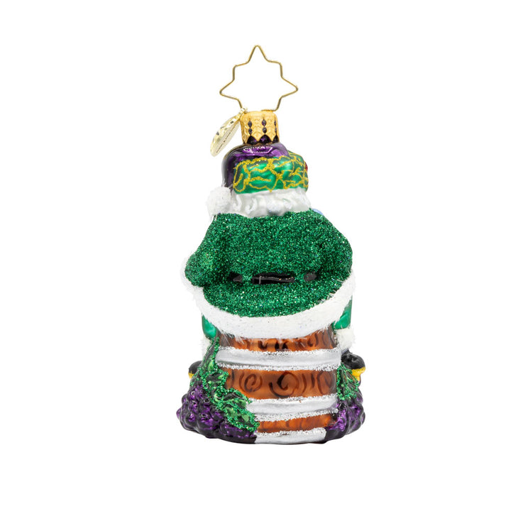 Time for Fine Wine Santa Gem ornament. Perched on a wine barrel, Santa holds a glass of wine and bottle. View of back.