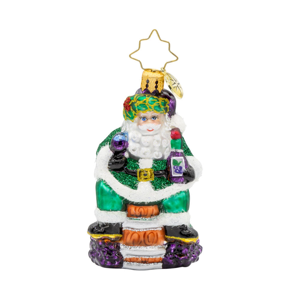 Time for Fine Wine Santa Gem ornament. Perched on a wine barrel, Santa holds a glass of wine and bottle. View of front.