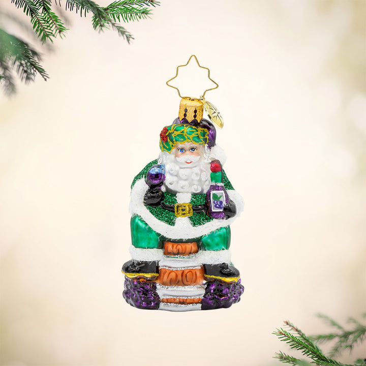 Time for Fine Wine Santa Gem ornament. Perched on a wine barrel, Santa holds a glass of wine and bottle. View of front.