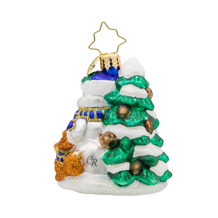 Wintery Pals Gem ornament. A snowman is seen with his forest friends in front of a pine tree covered in snow. View of back.