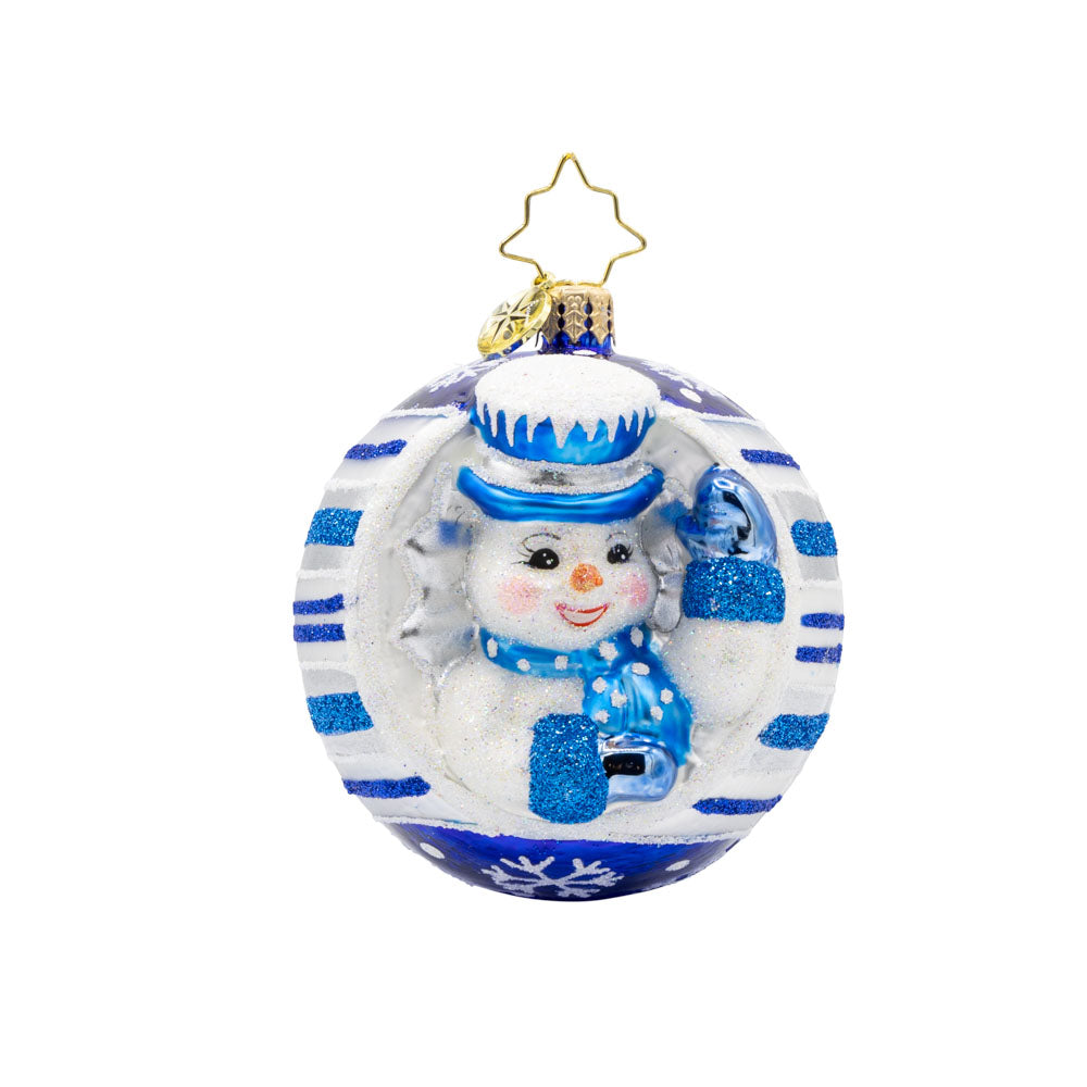 Snowy Spherical Cheer Gem ornament. A snowman dressed in a blue hat, scarf, and mittens. Encircled in a white ornament with blue stripes. View of front. 