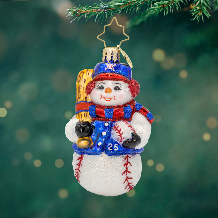 Snowy Slugger Gem ornament. A snowman dressed in baseball attire, ball and bat in hand. View of front. 