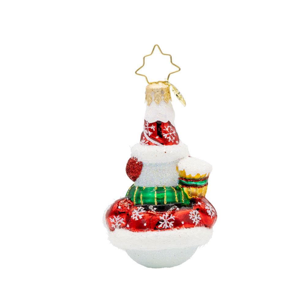 Swept Up Snowman Gem ornament. A snowman donned in a red and snowflake flecked coat with a broom in hand. View of back.