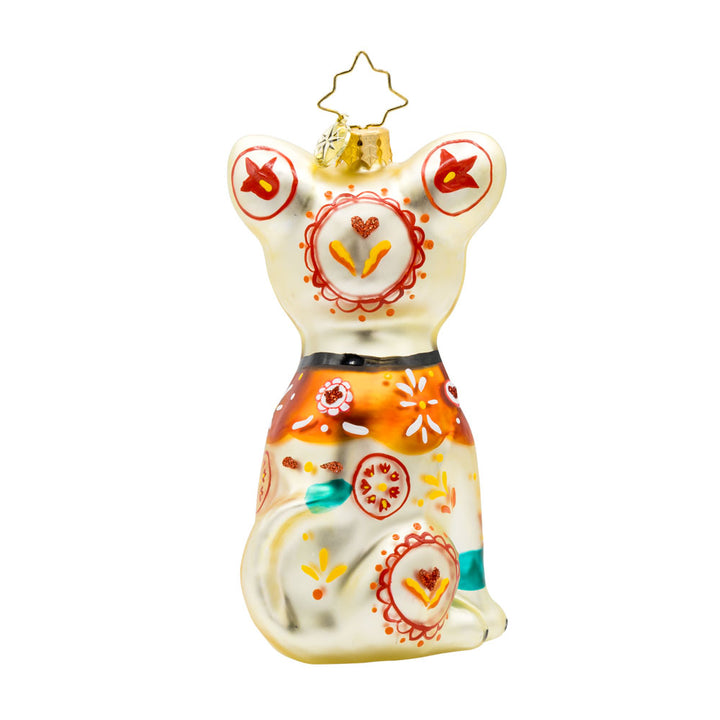 Fiesta Fido Calavera ornament. Inspired by Día de los Muertos, a dog painted with bold colors and intricate designs. View of back.