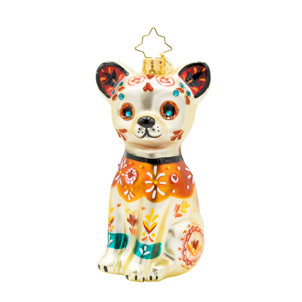 Fiesta Fido Calavera ornament. Inspired by Día de los Muertos, a dog painted with bold colors and intricate designs. View of front. 