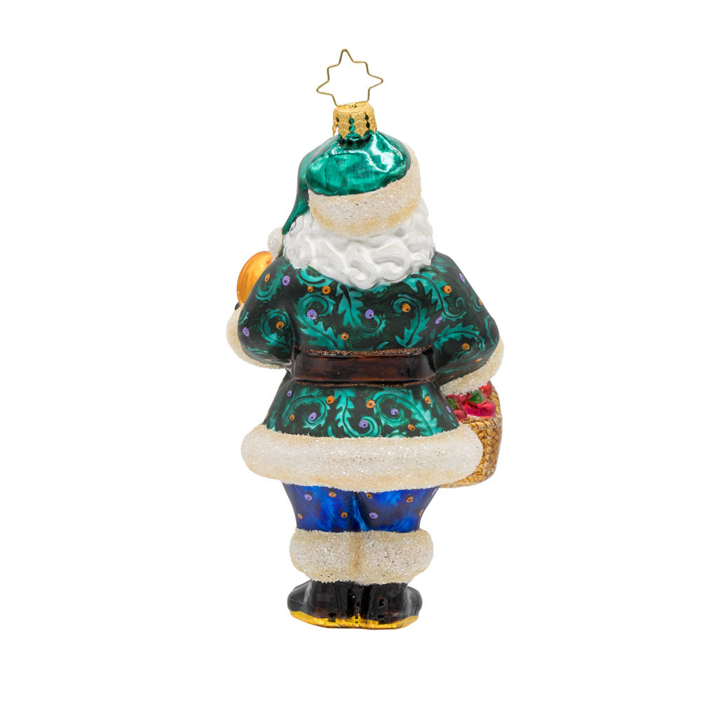 Enchanted Evergreen Santa ornament. Dressed in his finest fall attire, he has a basket of apples in one hand and a pumpkin in the other. View of back.