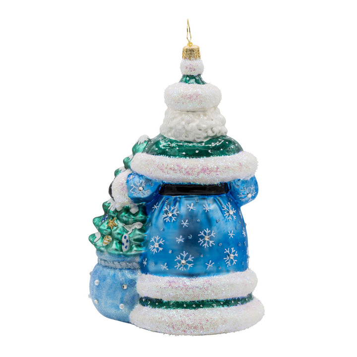 Christmas Enchanted Santa ornament. Santa dons' festive colors with sparkling details. A decorated Christmas tree is seen coming out of his gift sack. View of back.