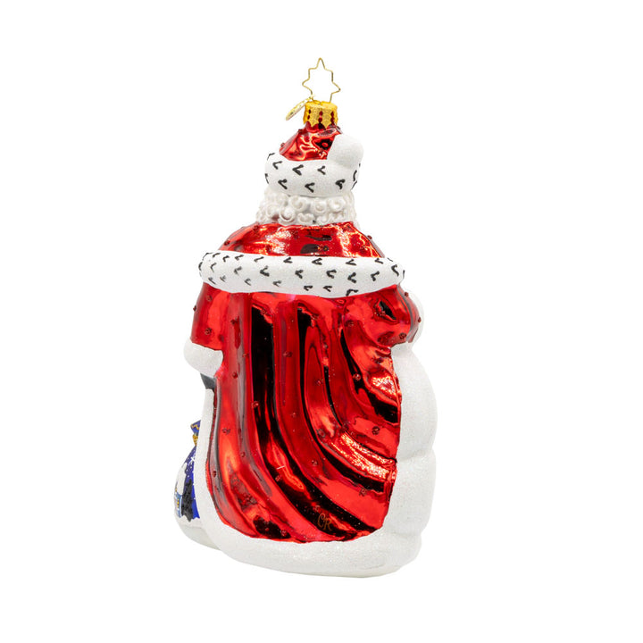 A Regal Christmas ornament. Santa is dressed in a royal red robe and festive cape. With a shiny staff and touch of glitter everywhere. View of back.