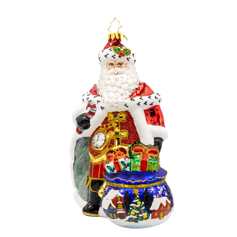 A Regal Christmas ornament. Santa is dressed in a royal red robe and festive cape. With a shiny staff and touch of glitter everywhere. View of front.