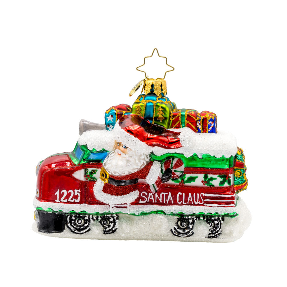 Claus the Conductor ornament.  This isn't your ordinary sleigh ride! Santa traded his reindeer for a train full of gifts. View of front. 