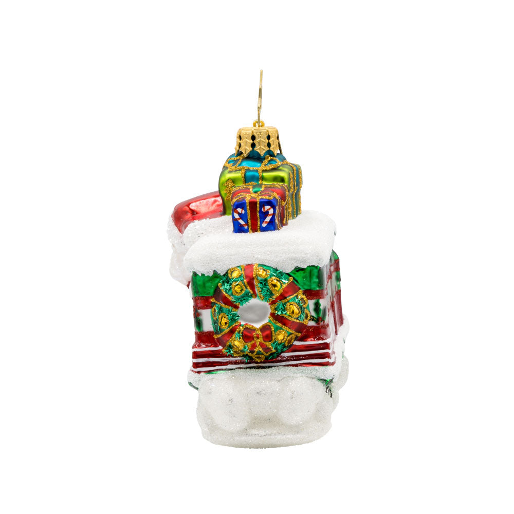 Claus the Conductor ornament.  This isn't your ordinary sleigh ride! Santa traded his reindeer for a train full of gifts. View of right side.