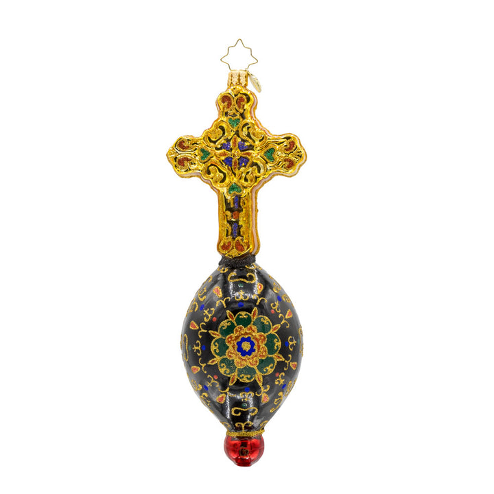 This exquisite ornament showcases a hand-painted nativity scene framed by a resplendent cross. Adorned with shimmering gems and vibrant colors. View of back.