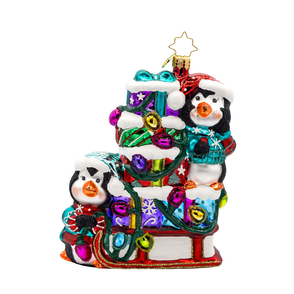 Flurry Friends Sleigh Ride ornament. Penguin pals on a holiday sleigh ride to deliver presents. View of front. 