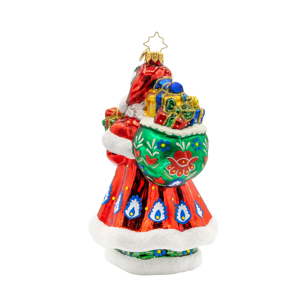 Folk Festive Claus ornament. Clad in a sumptuous dark green gown, adorned with a hand-painted folk pattern, this Santa celebrates the beauty of Polish heritage. View of back.