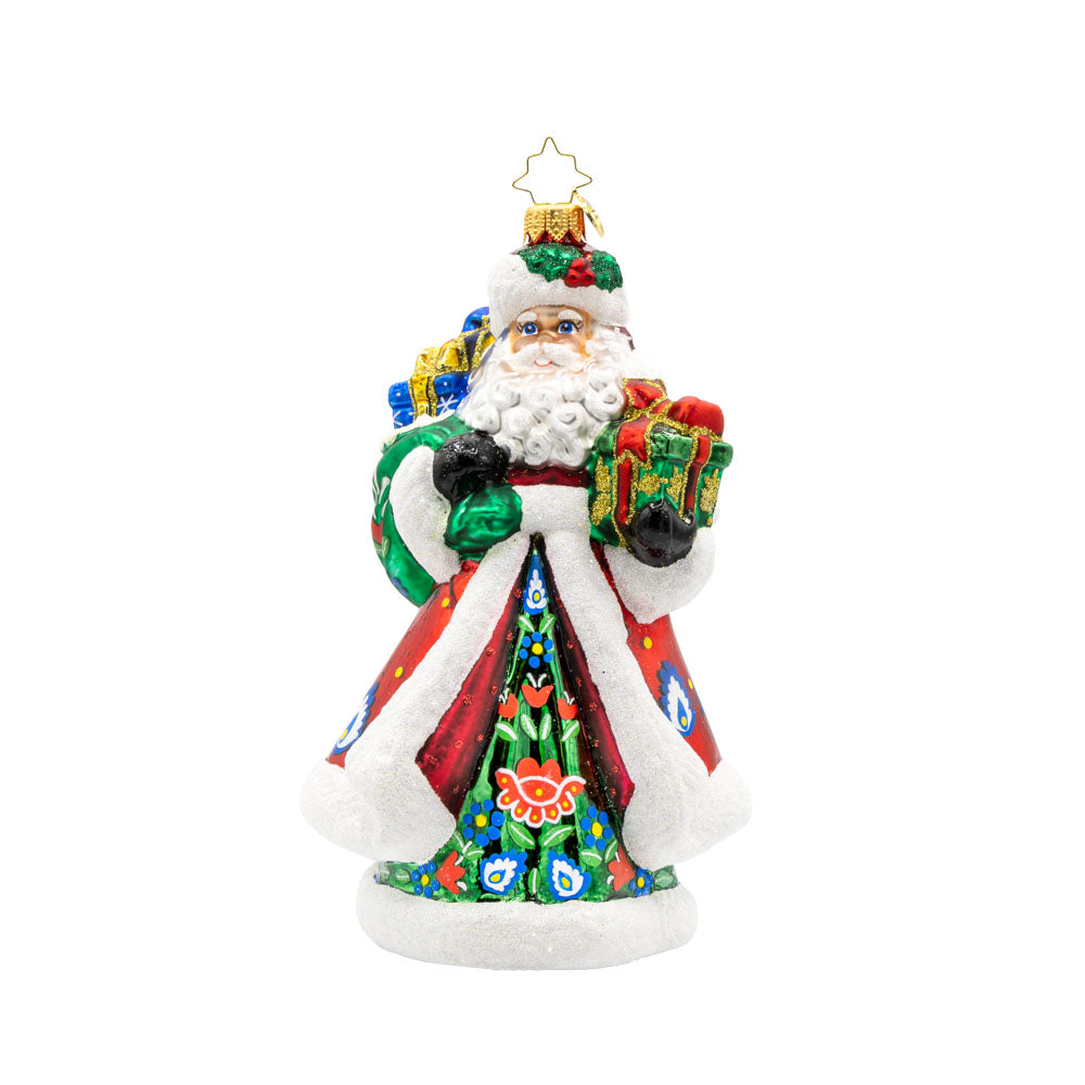 Folk Festive Claus ornament. Clad in a sumptuous dark green gown, adorned with a hand-painted folk pattern, this Santa celebrates the beauty of Polish heritage. View of front. 