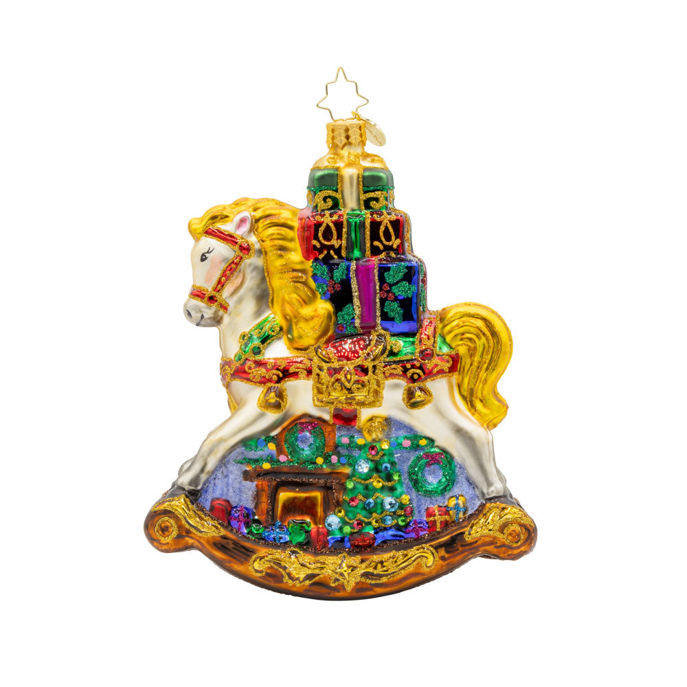 Rockin' Around Christmas ornament. Charming rocking horse with gifts stacked on its back. Hand-painted with a festive Christmas scene. View of right side.