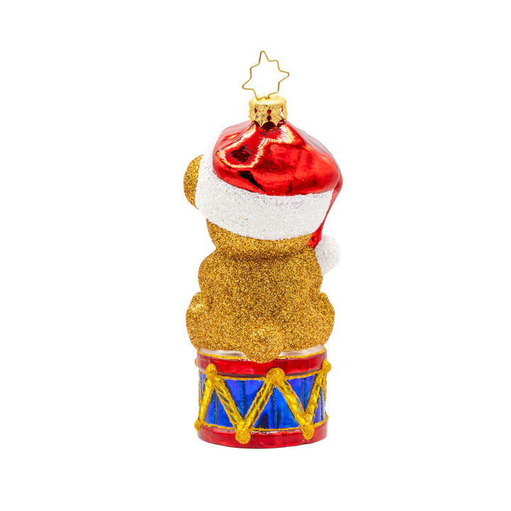 Teddy Bear Greetings ornament. Teddy bear wearing a Santa hat sitting atop a drum holding a sign that says "JOY." View of back.