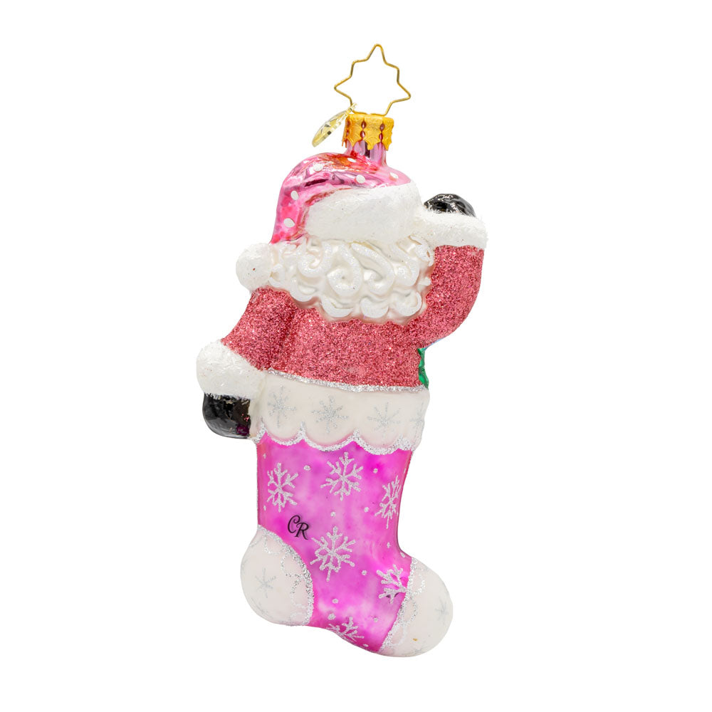 Santa's Stocking Stuffer ornament. Santa wears a shimmering pink suit and glittery hat. A colorful assortment of shiny brite ornaments adorn the stocking. View of back.