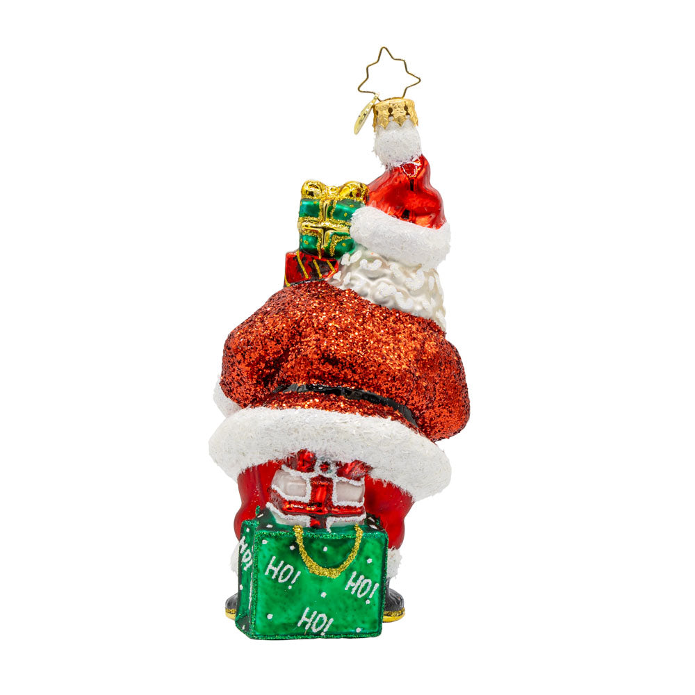 Santa's Surprise Stash ornament.  Features Santa carrying a tower of  festive presents. View of back.