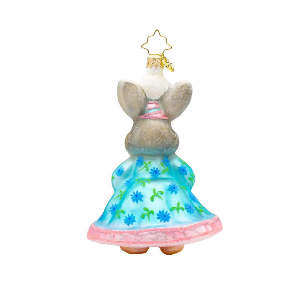 Hoppy Holiday ornament. This bunny is dressed in a blue and pink dress, with a gift in hand. View of back.