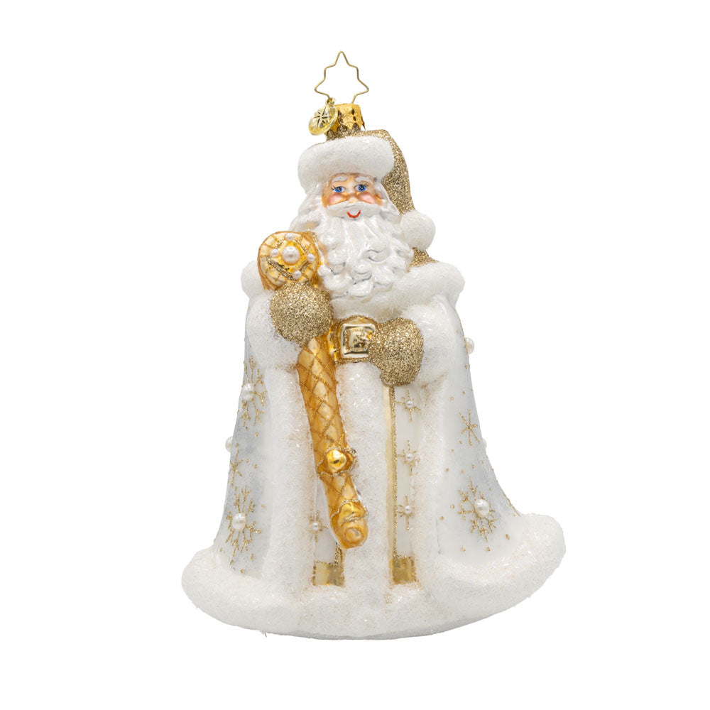 Gilded Kris Kringle ornament. Dressed in a shimmering robe, adorned with sparkling jewels and a regal crown. His festive cape and shimmering staff complete this elegant ensemble. View of front. 