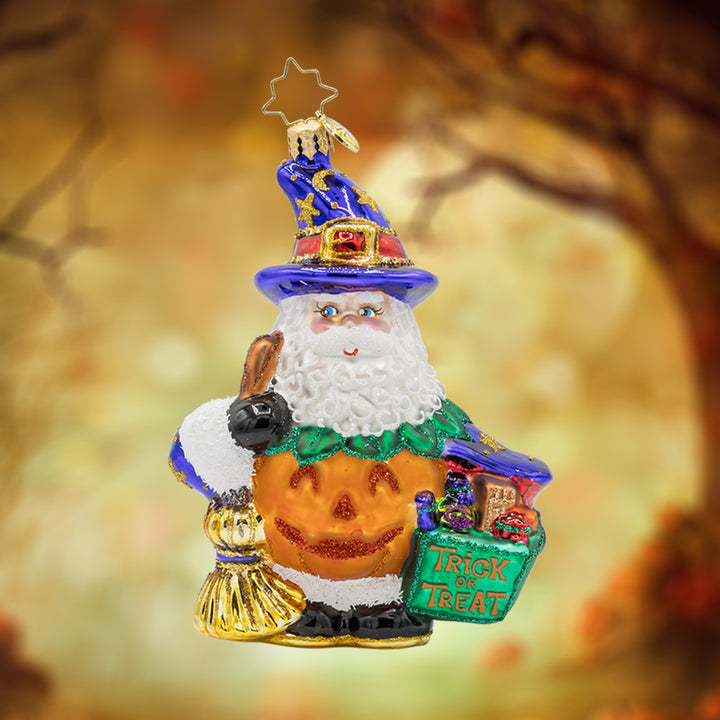 Jack- o'-Jolly Claus ornament. Santa trades his red suit for a pumpkin outfit, complete with a bright orange suit and a jack-o'-lantern face. View of front.