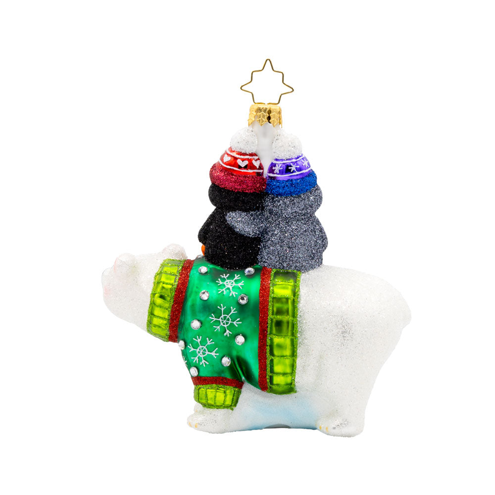 Iceberg Buddies ornament. This polar bear, cozy in his Christmas sweater, is completed by two playful penguins riding atop his back. View of back.