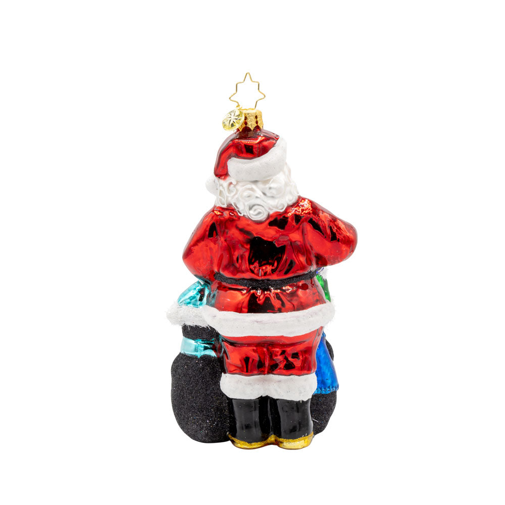Santa Flurry Friends ornament. Santa is standing with three penguins in front of him, holding a gift with the Dave Thomas Foundation for Adoption logo on the front of it. View of back.