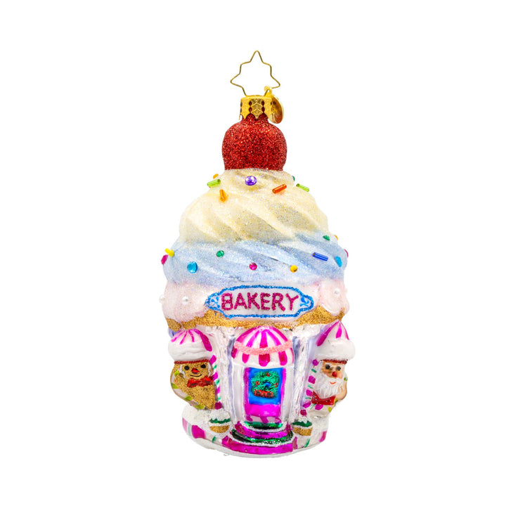 Confectionery Corner ornament.  A cupcake shop, complete with frosting, sprinkles, and all the festive flavors. View of front. 
