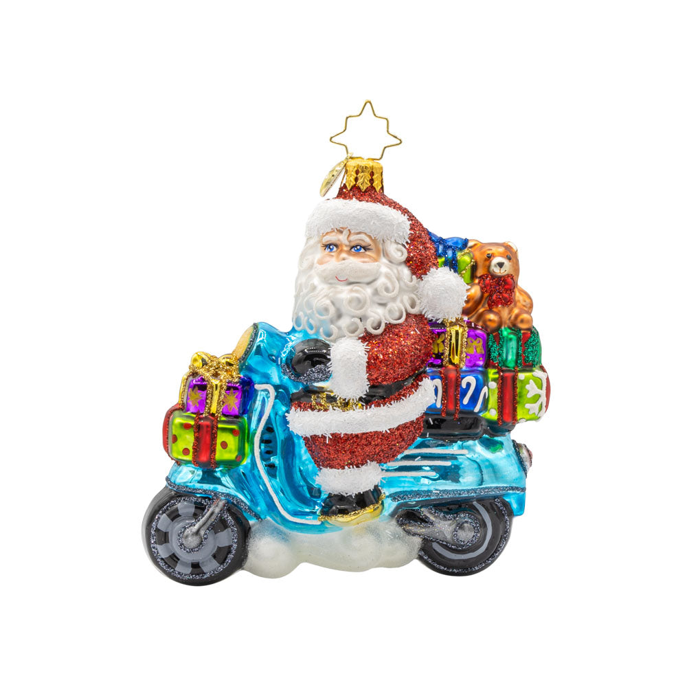 Vroom Vroom Voyage ornament. Santa is ditching the sleigh for a shiny Vespa full of gifts. View of front.