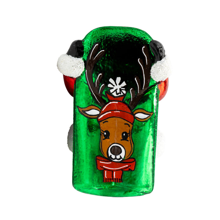 Snowy Sleigher ornament. Dressed in his red suit, Santa is perched on his sled, with a gift sack of presents on his back. Painted portrait of a reindeer on bottom of ornament. View of bottom. 