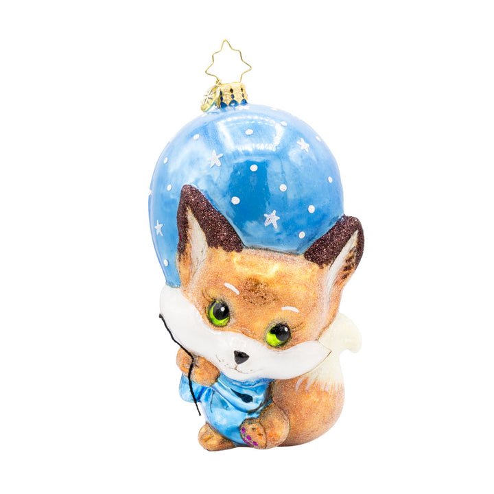 Blue Foxy Float ornament. Featuring a baby fox holding onto a blue balloon. View of front. 