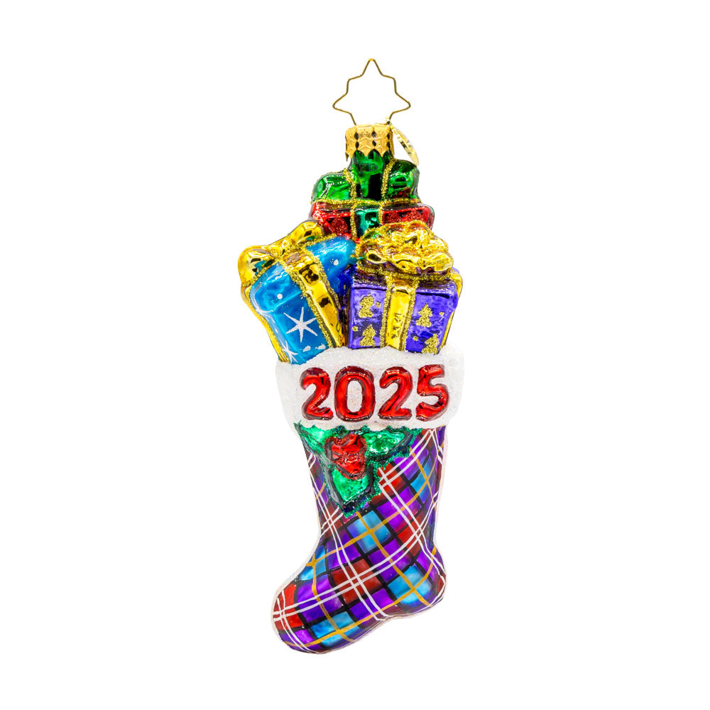 2025 Stacked Holiday Joy ornament.  Hand-painted plaid stocking dated "2025" with presents coming out the top. View of front. 