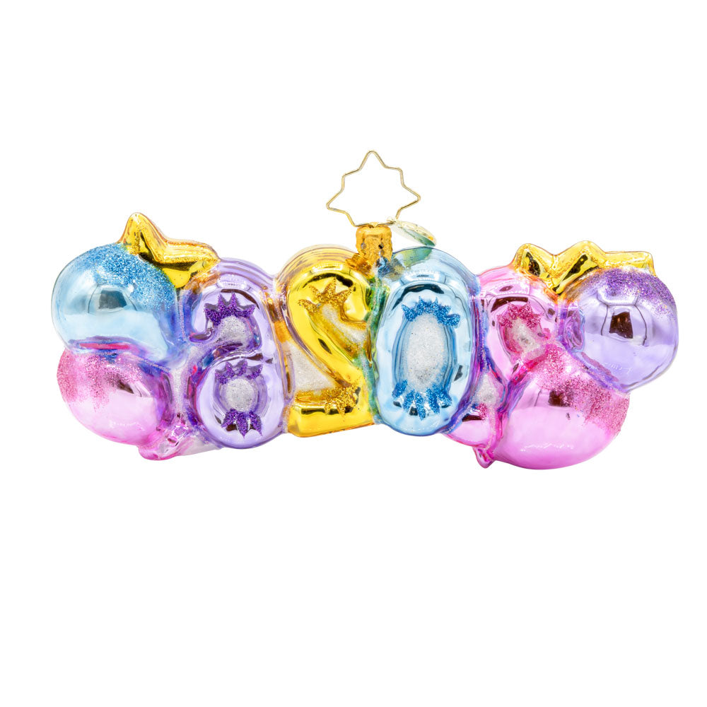 Cheers to 2026 ornament. "2026" shaped ballons in festive colors of pink, gold, blue and purple. Accompanied with a bottle of bubbles and flute glasses. View of back.