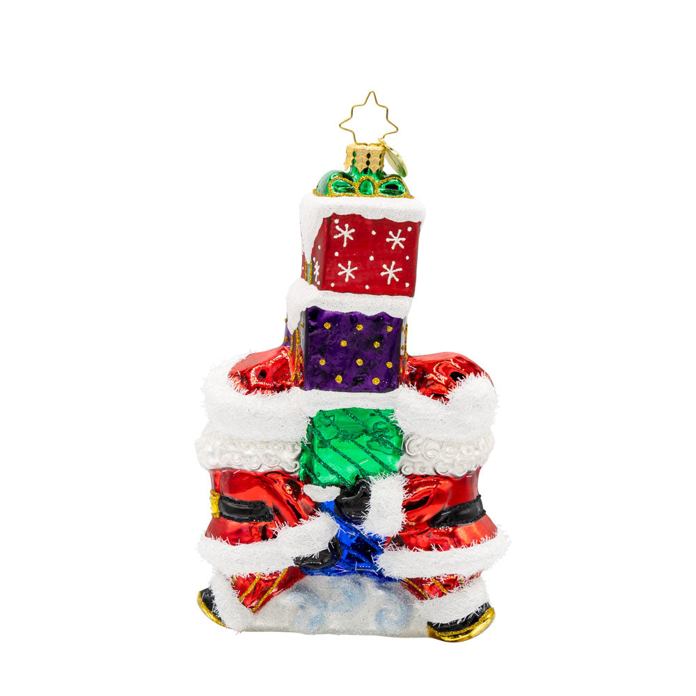 Gift Giving Santa's 2025 ornament. Two Santa's carry a stack of gifts with "2025" written on them. View of back.