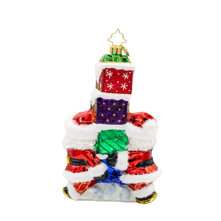 Gift Giving Santa's 2025 ornament. Two Santa's carry a stack of gifts with "2025" written on them. View of back.