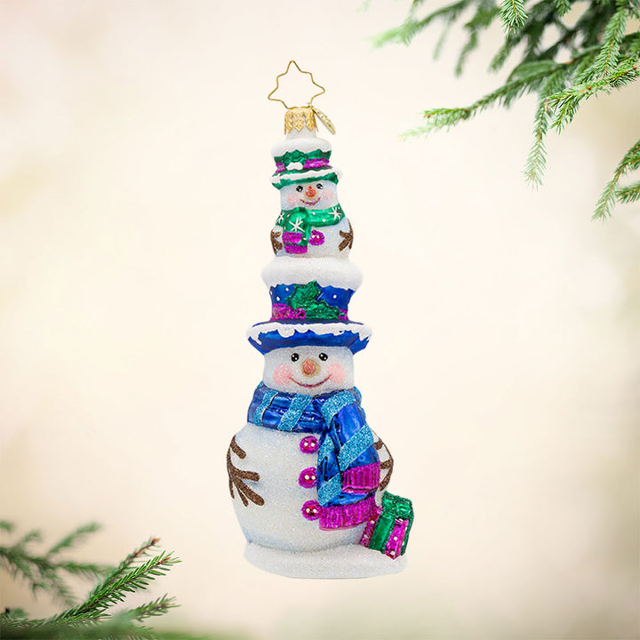 Double Decker Snow Chums ornament. A smaller snowman sits atop another. Both are dressed in festive colors of blue, purple, and green. View of front. 
