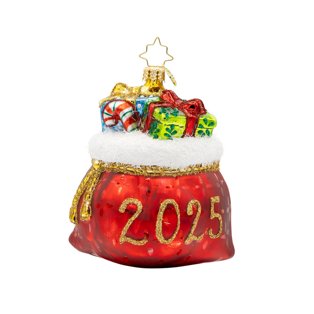 Yearly Yuletide Tote ornament. The gift bag is filled with festive presents, dated "2025." View of front. 