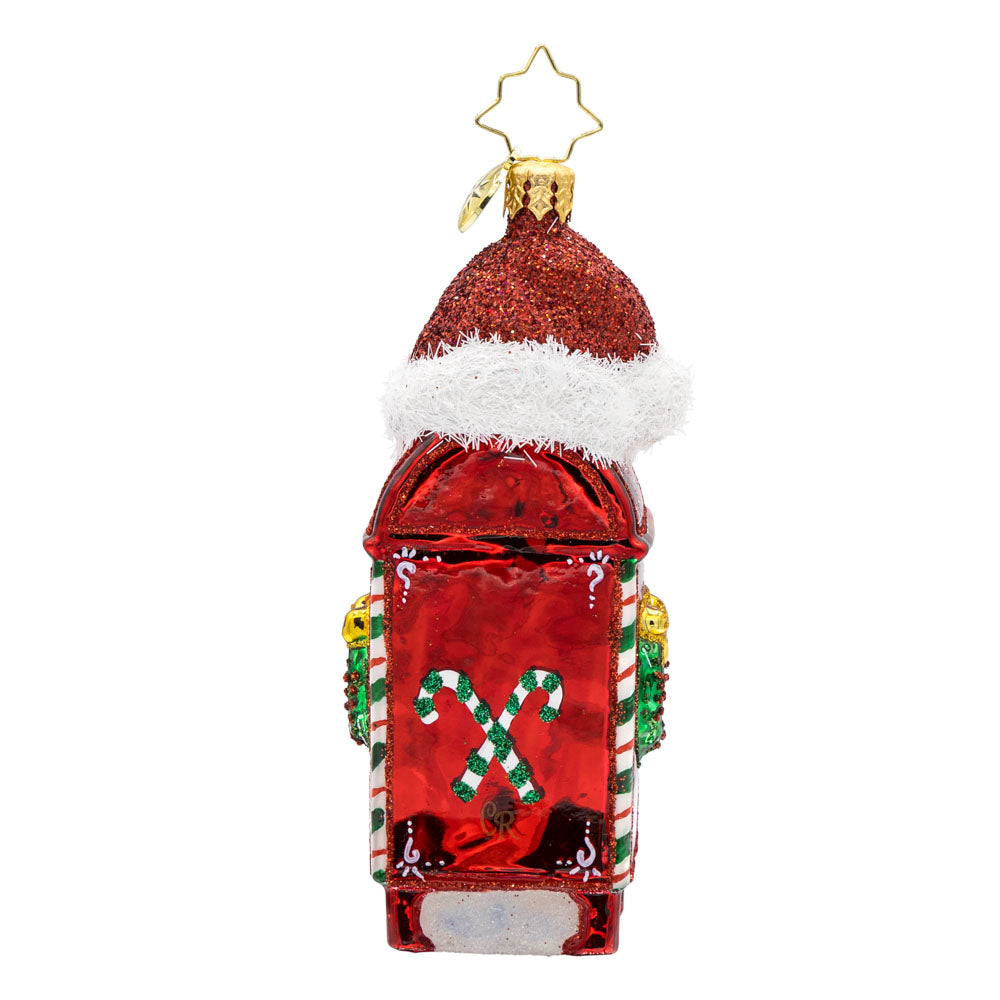 North Pole Postbox ornament. A festively decorated red postbox with "Letters to Santa" written on it. Topped with Santa's red hat. View of back.