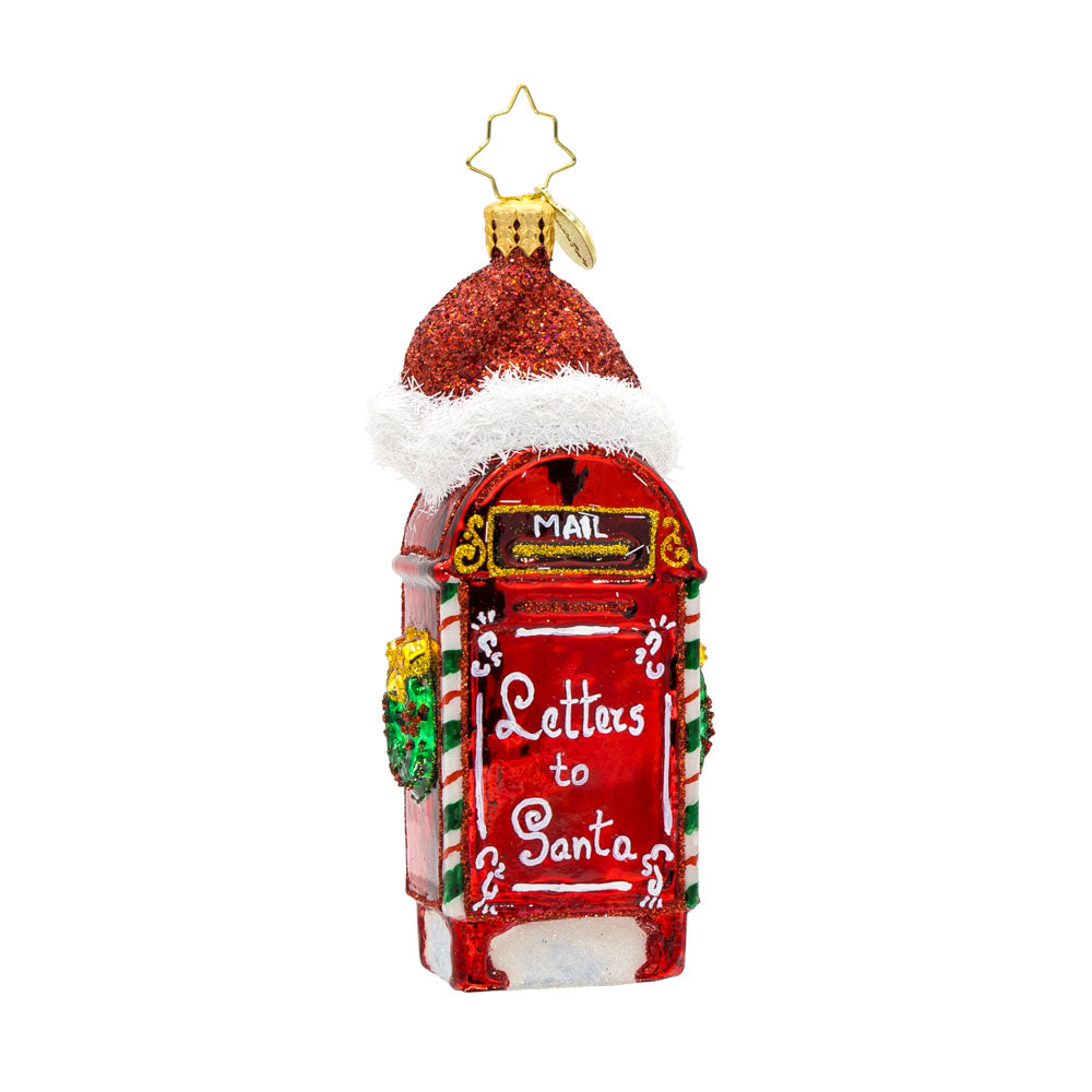North Pole Postbox ornament. A festively decorated red postbox with "Letters to Santa" written on it. Topped with Santa's red hat. View of front. 