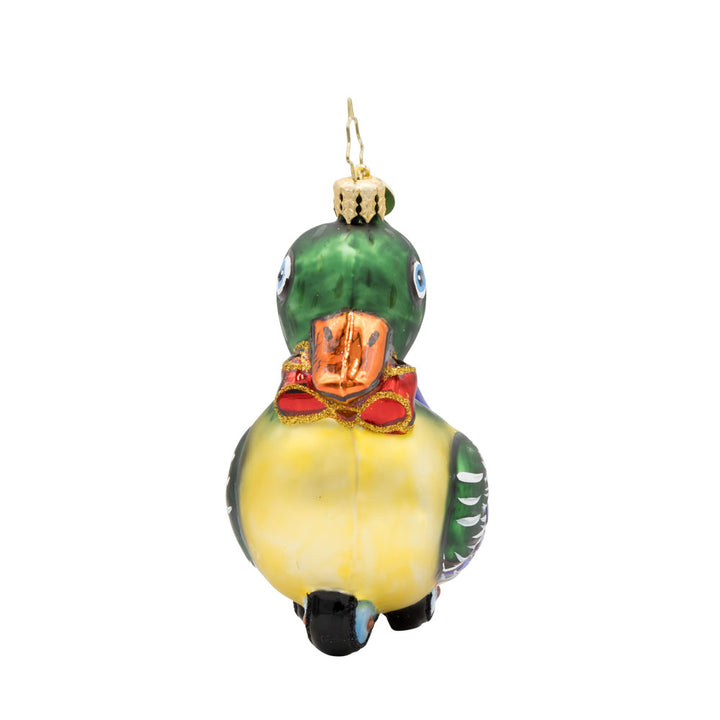 Dapper Duckling ornament. This wind-up duck dons' shiny green feathers, sparkling eyes, and a dapper red bow. View of right side.