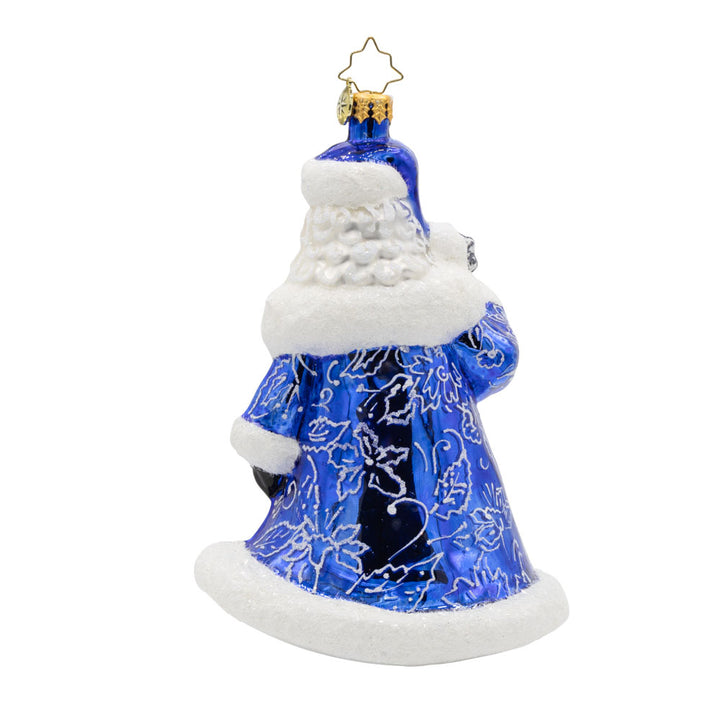 Chinoiserie Santa Charm ornament. Donning a blue satin gown adorned with intricate floral patterns, silver glitter ties, and deep blue gems. View of back.