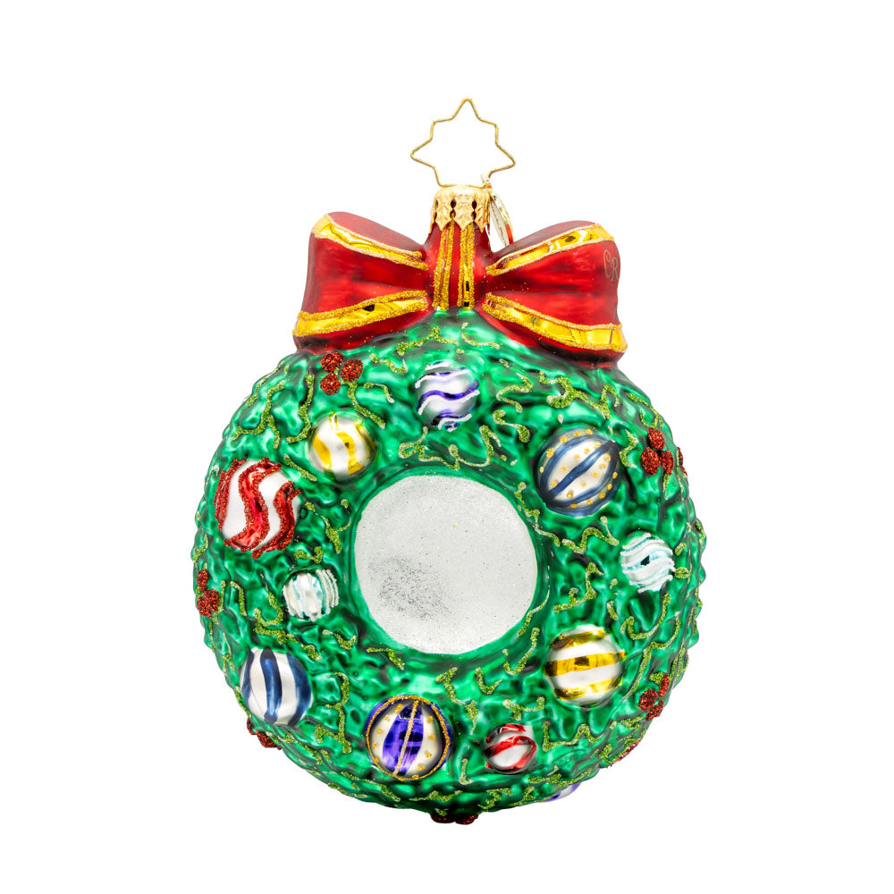 Smiling Through 2025 ornament. Santa is encircled by a Christmas wreath. Ornament balls are dated with "2025." View of back.
