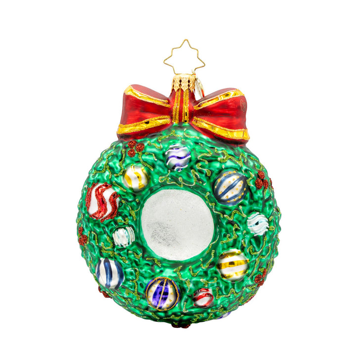 Smiling Through 2025 ornament. Santa is encircled by a Christmas wreath. Ornament balls are dated with "2025." View of back.