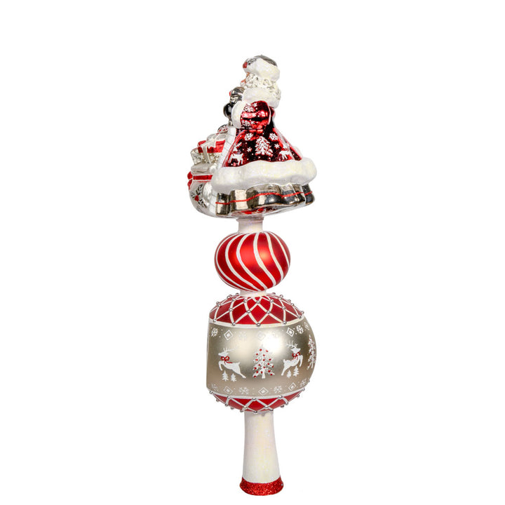 This enchanting finial features Santa, with his rosy cheeks, snowy beard, and a sack full of gifts above two decorated rounds. View of right side.