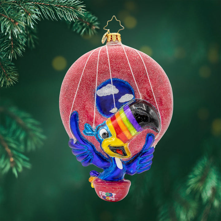 Toucan Sam's Balloon Ride Ornament. Join him as he soars through the clouds in his dazzling hot air balloon shaped like a giant Froot Loop. View of front.