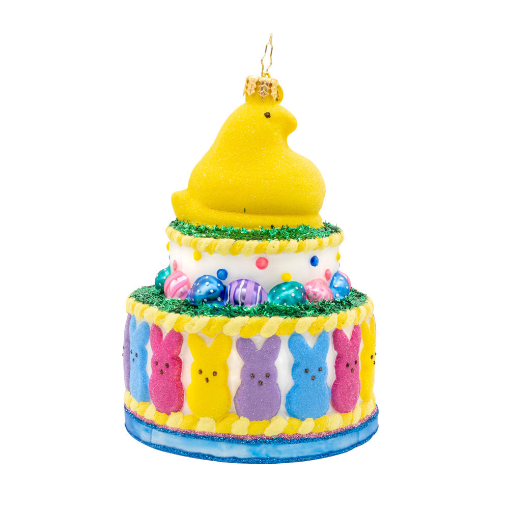This charming PEEPS cake ornament is stacked with colorful candies and cute shapes. View of left side.